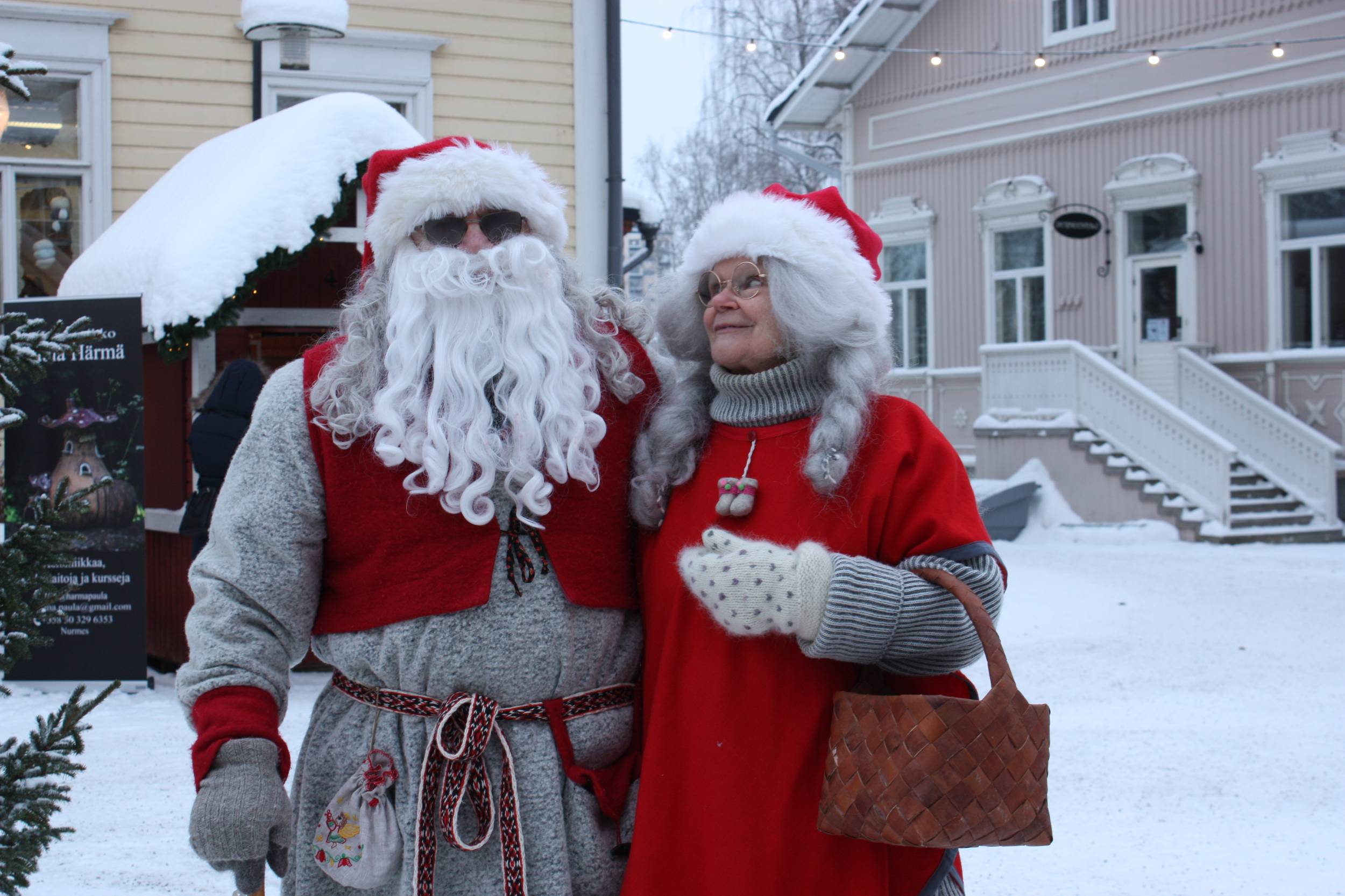 Traditional Finnish Santa Claus and Mrs. Claus in Taitokortteli courtyard